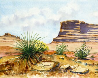 May include: Watercolor painting of a desert landscape featuring a large rock formation and sparse vegetation. The foreground shows green spiky plants and yellow flowers. The sky is a light blue with white clouds.