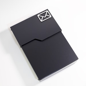 May include: A black metal mailbox with a silver envelope icon on the front.