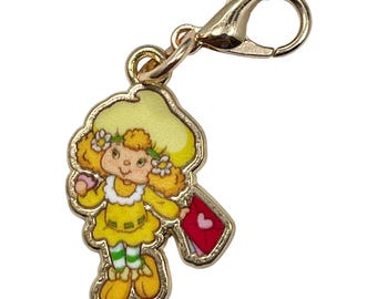 Llavero vintage de Strawberry Shortcake con forma de merengue de limón y tirador de cremallera para bolso, acrílico dorado
