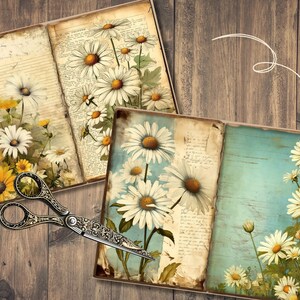 May include: Two open vintage journals with pages filled with handwritten text and illustrations of white daisies. The journals are on a rustic wooden surface with a pair of antique scissors.