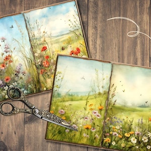May include: Two open books displaying watercolour illustrations of a wildflower meadow. The pages show colourful flowers, tall grasses, and a blue sky. A pair of ornate scissors rests on a wooden surface, adding a vintage touch to the scene.