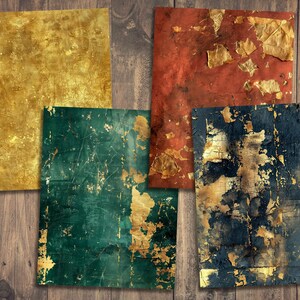 May include: Four textured paper squares with gold leaf accents. The squares are in shades of gold, red, green, and blue.