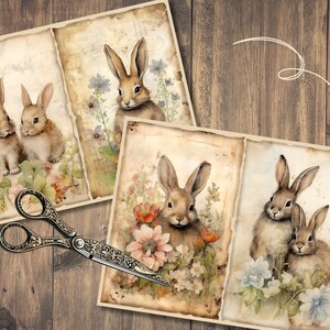 May include: Three vintage-style cards featuring watercolor illustrations of bunnies in a floral setting. The cards have a distressed, aged look and are perfect for scrapbooking or crafting.