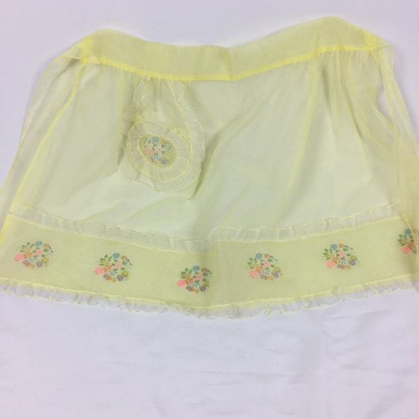 Vintage Sheer Yellow Apron with Floral Design along Ruffled Hem, Decorative Pocket with Ruffles, Floral Print and Lace Print, Back Tie Sash