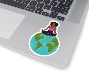 May include: A sticker featuring a woman meditating on top of a blue and green globe. The woman has brown skin, black hair, and is wearing a pink shirt and black pants.