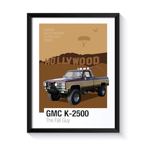 Peut inclure: Un camion GMC K-2500 marron et beige sur fond blanc. Le camion roule sur un chemin de terre avec l'enseigne d'Hollywood en arrière-plan. Le texte "Make Eastwood Look So Fine!" est en haut de l'image. Le texte "GMC K-2500" et "The Fall Guy" sont en bas de l'image.