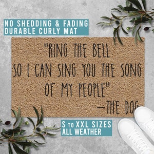May include: A brown doormat with the text "Ring the bell so I can sing you the song of my people" - The Dog. The doormat also says "S to XXL sizes, all weather".