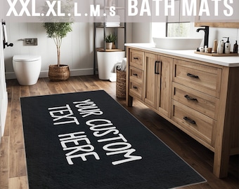 Puede incluir: Alfombra de baño negra con texto blanco que dice "YOUR CUSTOM TEXT HERE".