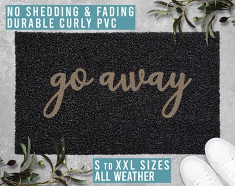 May include: Black doormat with the text "go away" in a gold cursive font. The doormat is made of durable curly PVC and is available in sizes from small to extra extra large. The doormat is suitable for all weather conditions.
