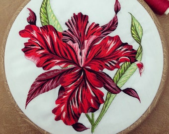 Intricate red floral embroidery wall hanging
