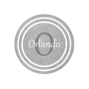 May include: A gray round coaster with a white double ring border and the text "Orlando" and the number "0" in the center.