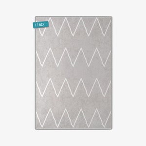 May include: A gray rug with a white chevron pattern. The rug has a subtle texture and is perfect for adding a touch of modern style to any room.