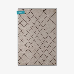 May include: A beige rug with a geometric pattern of brown lines forming a diamond shape. The rug has the number "105E" printed on a blue label in the top left corner.