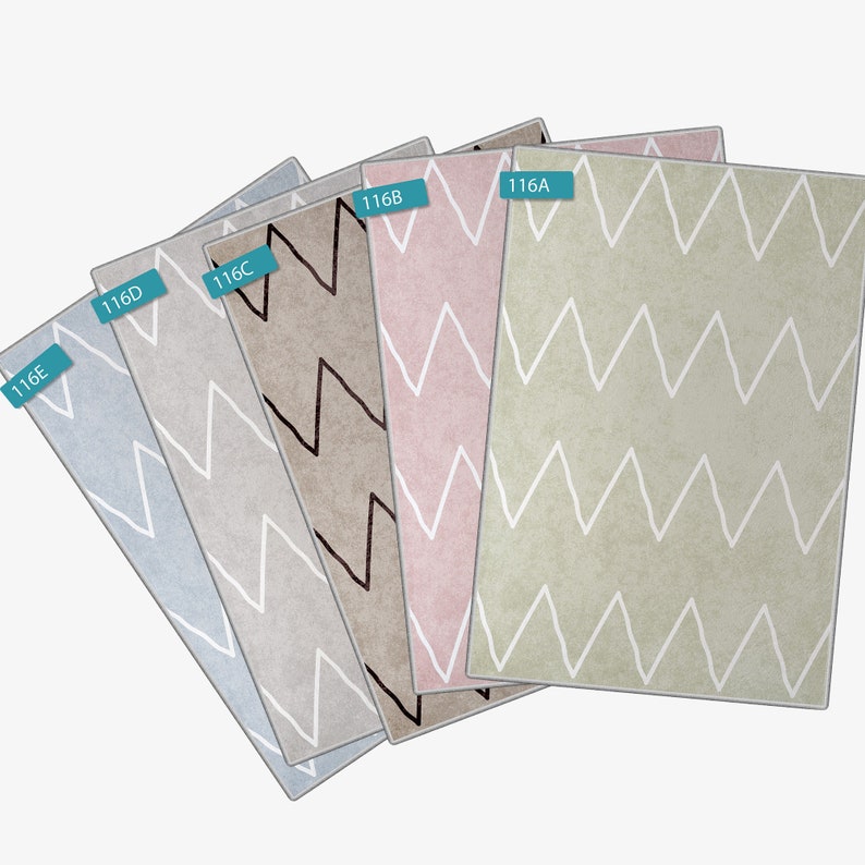 May include: Five different colored rugs with a white chevron pattern. The rugs are labeled 116E, 116D, 116C, 116B, and 116A.