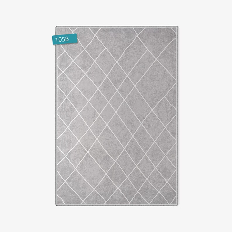 May include: A gray area rug with a white diamond pattern. The rug has the number 105B printed on a blue label.