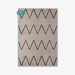 May include: A beige rug with a black chevron pattern. The rug has a subtle texture and a modern design.