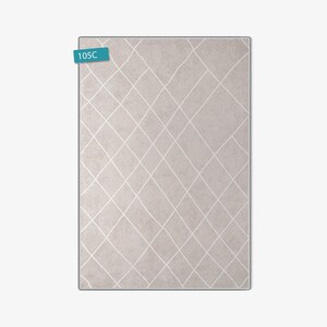 May include: A light beige rug with a white diamond pattern. The rug has a subtle texture and a modern design.
