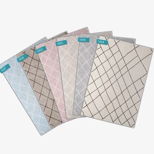 May include: Six different color rugs with a diamond pattern in black. The rugs are arranged in a fan shape with the labels 105F, 105E, 105D, 105C, 105B, and 105A.