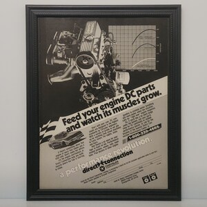 May include: Black and white vintage advertisement for Chrysler Direct Connection featuring a close-up of a car engine with the text "Feed your engine DC parts and watch its muscles grow." and "a performance revolution."  The ad also includes a graph showing engine performance.
