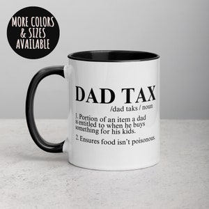 May include: White ceramic coffee mug with a black handle and black rim. The mug has a black and white graphic that says "DAD TAX /dad taks/ noun 1. Portion of an item a dad is entitled to when he buys something for his kids. 2. Ensures food isn't poisonous."