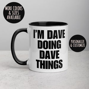 May include: White ceramic mug with a black handle and interior. The mug features the text "I'M DAVE DOING DAVE THINGS" in bold black letters. Additional text on the image reads "MORE COLORS & SIZES AVAILABLE" and "PERSONALIZE & CUSTOMIZE".