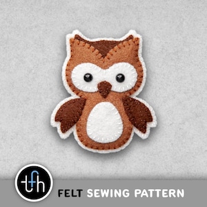 May include: A felt owl appliqué featuring brown and white fabric pieces joined with visible white stitching. The owl has two black bead eyes, a dark brown triangular beak, and a white belly patch. The text "tfh FELT SEWING PATTERN" is below.