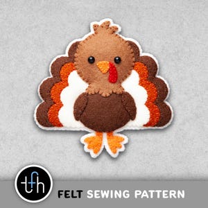 May include: A felt turkey sewing pattern with brown, orange, white, and tan colors. The turkey has a red wattle, black eyes, and orange feet. The text "FELT SEWING PATTERN" is at the bottom.
