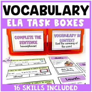 May include: An orange plastic container with the words "VOCABULARY ELA TASK BOXES" in black and purple. The container holds vocabulary task cards with the text "COMPLETE THE SENTENCE homophones" and "VOCABULARY IN CONTEXT find the meaning of the word". The text "16 SKILLS INCLUDED" is also visible.