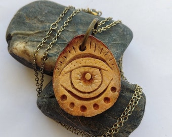 Carved avocado pit - all seeing eye - avocado necklace - avocado - avocado jewelry - avocado stone - festival jewelry - third eye