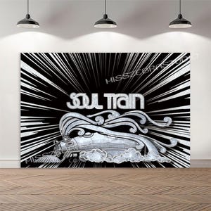 May include: A black and white graphic featuring the words "SOUL TRAIN" in silver, with a stylized train illustration. The background has radiating white lines, creating a dynamic visual effect. The image is set against a black backdrop.