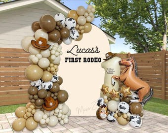 May include: A brown, white, and black balloon arch with a cowboy hat and the text "Lucas's First Rodeo". There is a brown horse balloon and a large number one balloon with the text "Wilder's First Rodeo".