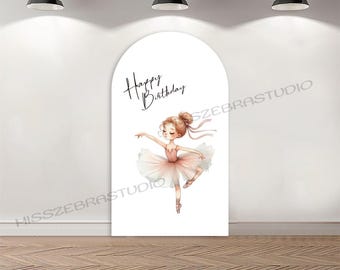 May include: A white arched backdrop with a watercolor illustration of a ballerina in a pink tutu. The words "Happy Birthday" are written in elegant script above the ballerina. The backdrop is set against a white wall and a wooden floor.