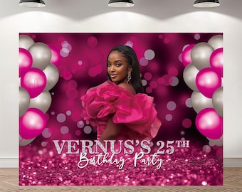May include: A magenta and silver birthday party backdrop featuring a woman in a pink dress. The backdrop has the text "Vernus's 25th Birthday Party" in silver glitter. Pink and silver balloons are on either side of the woman.