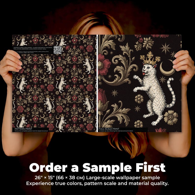 May include: Two wallpaper samples are held up, showcasing a pattern print and a full-scale print. The pattern print features white cats, red flowers, and gold accents on a dark background. The full-scale print displays a crowned cat. The samples are 66 cm x 38 cm.