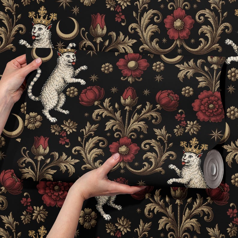 May include: Black wallpaper featuring a repeating pattern of gold scrollwork, red flowers, and crowned white cats. The wallpaper is being unrolled, showcasing the design. The overall theme is a whimsical, vintage aesthetic.