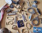 Vintage lot of junk drawer items. Odds and ends. 4 Watches, handcuffs, jewelry, lock and key, skeleton key, brass, can bottle openers etc