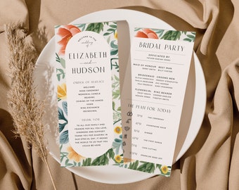 May include: A floral wedding program with a white background and a floral border. The program includes the order of service, the bridal party, and the plan for the day. The text is in black and the flowers are in shades of pink, yellow, and green.