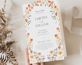 Peut inclure: Une invitation de mariage avec une bordure florale dans des tons d'orange, de jaune et de rose. Le texte indique "Bienvenue au mariage de Tabitha et William, samedi 5 août Deux mille vingt-cinq. Merci à toute notre famille et à tous nos amis pour tout votre amour, votre gentillesse et votre soutien. Merci d'avoir partagé notre journée spéciale. Cela signifie beaucoup pour nous que vous puissiez être là."