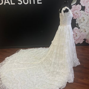 Vintage lace off-shoulder cathedral train wedding dress