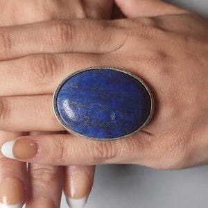 An oversized big blue Lapis Lazuli statement ring, with an adjustable silver band for comfortable fit. Ideal gift for women.