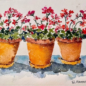 Può includere: Acquerello di tre vasi di terracotta pieni di gerani rossi. I vasi poggiano su una superficie azzurra, proiettando ombre. L'opera è firmata "B. Mannion 2021".