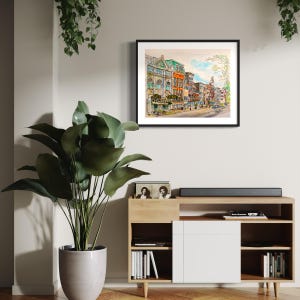 May include: A watercolour painting depicting a city street scene with colourful buildings and a tree in the foreground. The buildings are in a row and have windows and doors. The street is paved and there are people walking on it.
