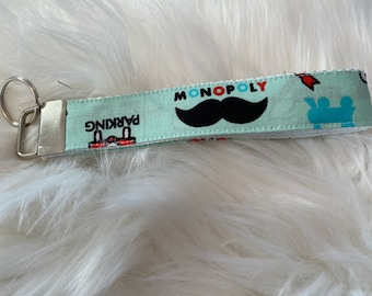Monopoly themed wristlet lanyard keychain