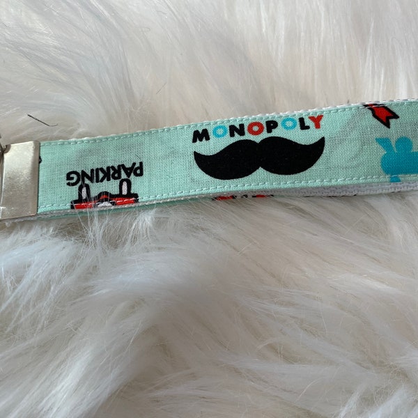 Monopoly themed wristlet lanyard keychain