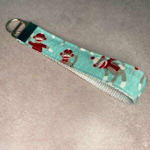Sock monkey wristlet lanyard