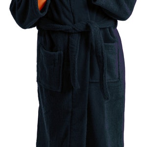 May include: A dark blue hooded robe with a tie belt. The robe is made of soft, plush fabric.