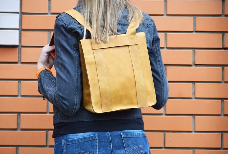 Nice backpack leather woman lady unisex curry orange color safe against theft bag quadratic originally extravagant long carrier student