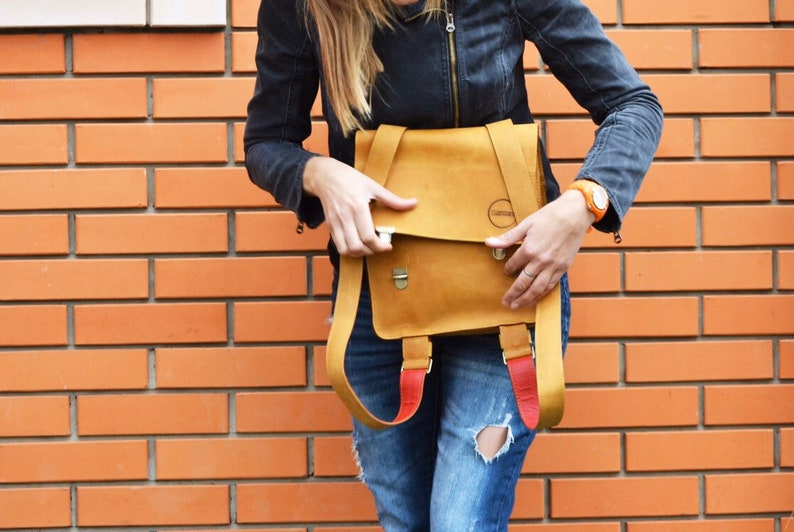 Nice backpack leather woman lady unisex curry orange color safe against theft bag quadratic originally extravagant long carrier student