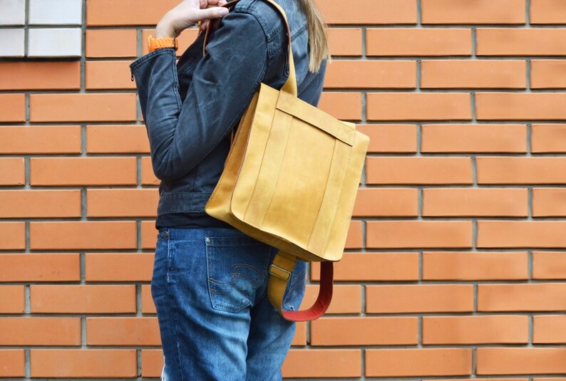 Nice backpack leather woman lady unisex curry orange color safe against theft bag quadratic originally extravagant long carrier student