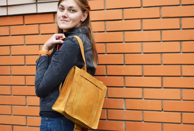 Nice backpack leather woman lady unisex curry orange color safe against theft bag quadratic originally extravagant long carrier student